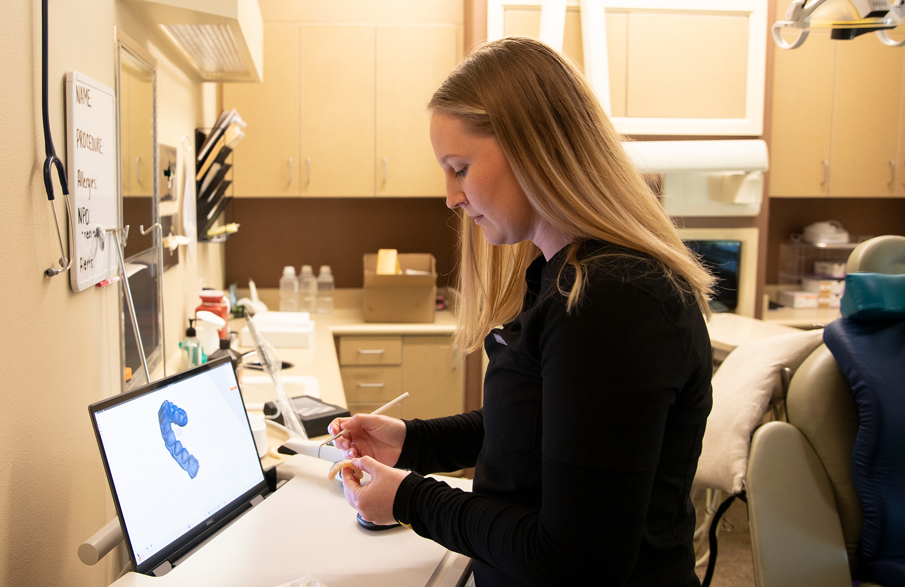 Lab technician crafting an implant restoration in the Wyo Dental Implants in-house lab