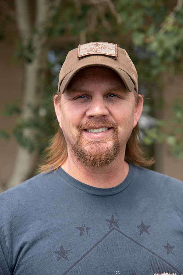 Happy patient after full-arch implant treatment in Casper