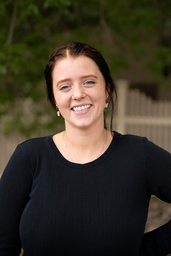Smiling patient photographed at the Wyo Dental Implants office